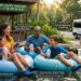 A detailed timeline infographic showing a family navigating the best natural springs near Orlando for families, starting at 7:30 AM at Kelly Park and visiting Silver Glen Springs