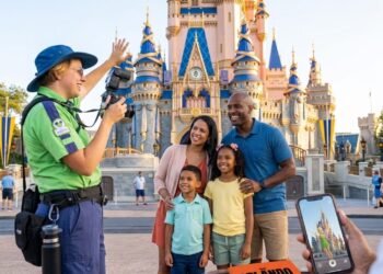 A family taking professional Family Photos in Orlando with a park icon and a sunset background in 2026.