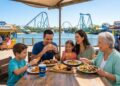 A family enjoying a wide variety of Cuisine Options at SeaWorld Orlando including the All-Day Dining Deal and Shark’s Underwater Grill